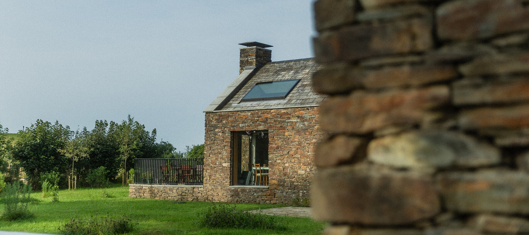 A modern extension on a property built from Cornish stone